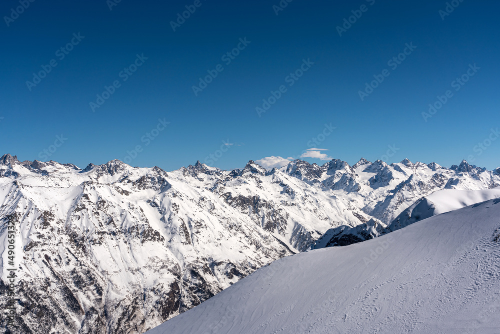 Mountain peaks covered with snow in winter. Mountain range in Caucasus region in Russia