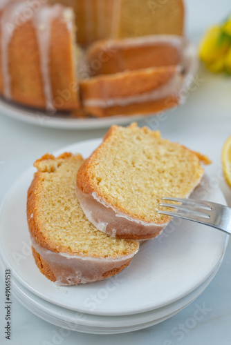 Traditional vanilla pound cake with lemon on a table