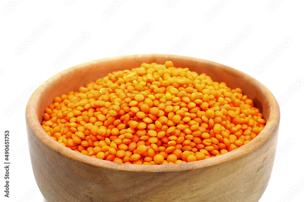 red lentils in a bowl isolated on white background red lentils in a bowl isolated on white background