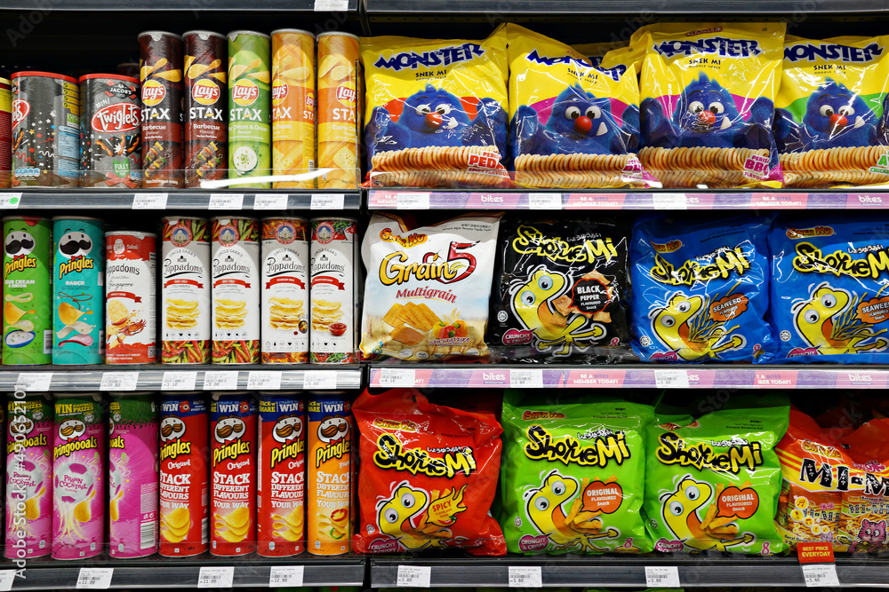 Snacks In Store SELANGOR, MALAYSIA - 27 FEB 2022. Various brands of flavoured chips and ...