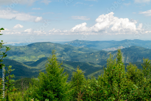 Summer landscape. Mountains covered with the shadow of clouds floating across the sky.