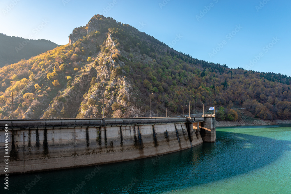 The Plastiras Dam, a concrete arch dam in Karditsa regional unit, Greece that impounds the Tavropos River, creating the artificial lake Plastiras. 