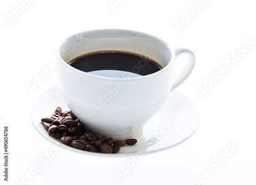 Coffee cup and beans isolated on white background