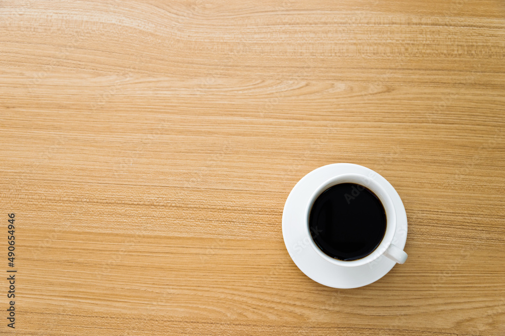 Cup of coffee on wooden table Cup of coffee on wooden table
