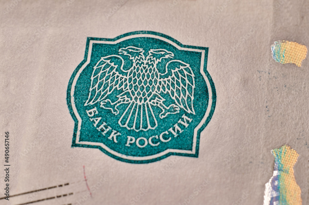 Obraz premium Banknotes and coins of the Russian ruble. The inscription Bank of Russia on a paper bill