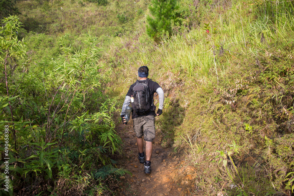 One backpacker man travel alone, with backpack in the mountains
One backpacker man travel alone, with backpack in the mountains