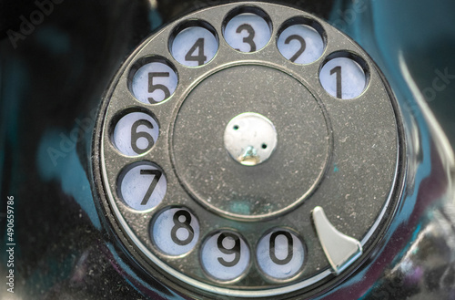 Photography Close up of black  retro telephone dialer circle with numbers