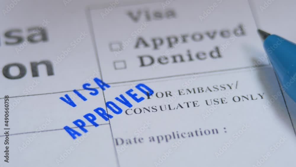Approved stamp in paper visa application. Spend vacation abroad. Visa opened. Permission for emigration in foreign country. Success interview in embassy. Blue pen