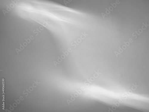 Gray abstract background with light shadow pattern