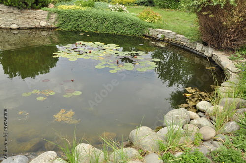 Garden pond. Pond in landscape design.