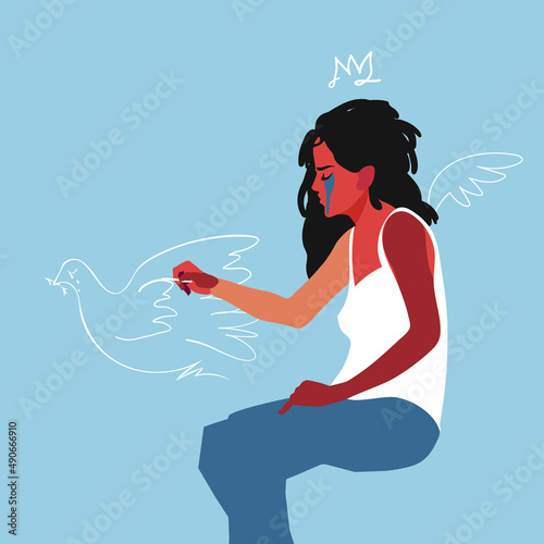 A crying girl draws a peace dove with chalk. The concept of peace and love