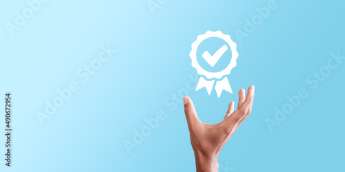 Hand shows the sign of the top service Quality assurance, Guarantee, Standards, ISO certification and standardization concept.