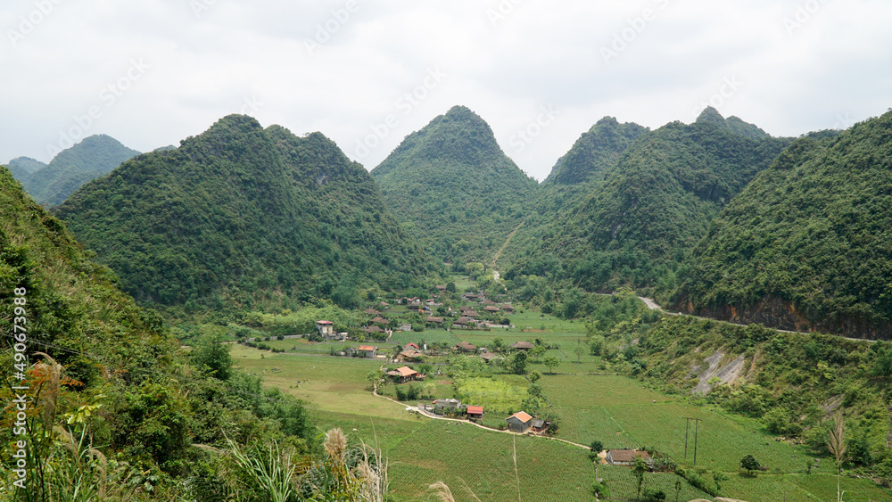 Green hill and mountains near rice fields in Bac Son Valley, Vietnam.