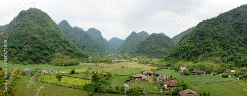 Green hill and mountains near rice fields in Bac Son Valley, Vietnam.