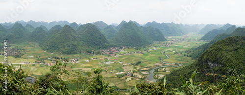 Fotografie Green hill and mountains near rice fields in Bac Son Valley, Vietnam