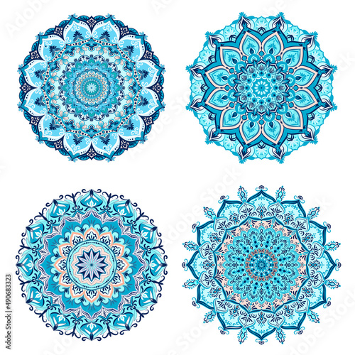 Luxurious set of 4 Mandalas. Turquoise ethnic ornament on a white background. Lace decorative ornament for printing.