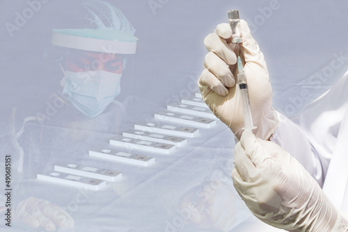 Doctor's hand holding a syringe, Concept fight against virus covid-19 coronavirus