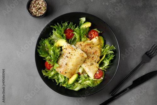 Canvas Print Dish with Gourmet fried halibut fish on Vegetable, fresh green salad