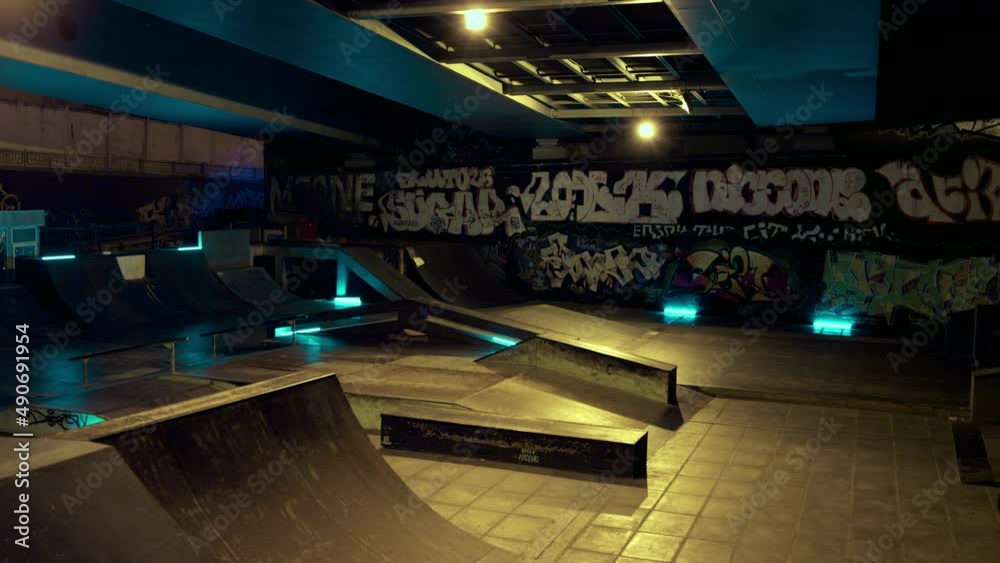Active people doing exercise together on scooter and bmx bike night skatepark. 