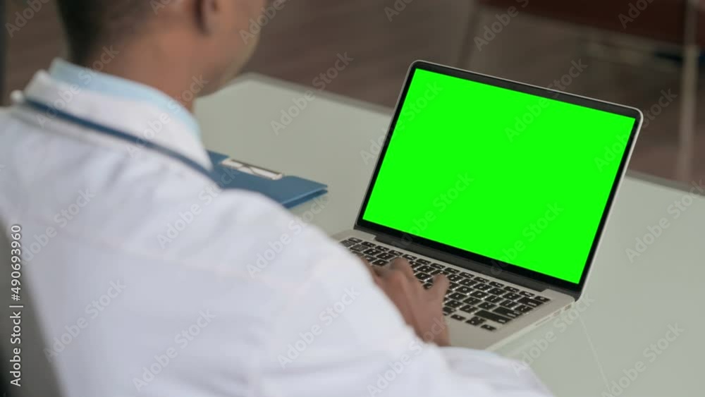 Young African Doctor Using Laptop with Green Screen Young African Doctor Using Laptop with Green Screen