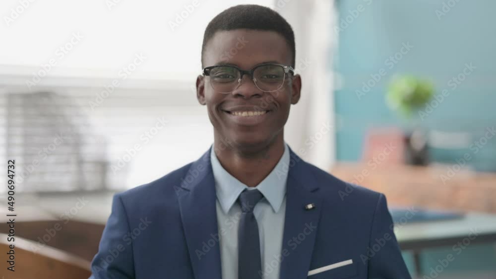 Young African Businessman Smiling at Camera Young African Businessman Smiling at Camera