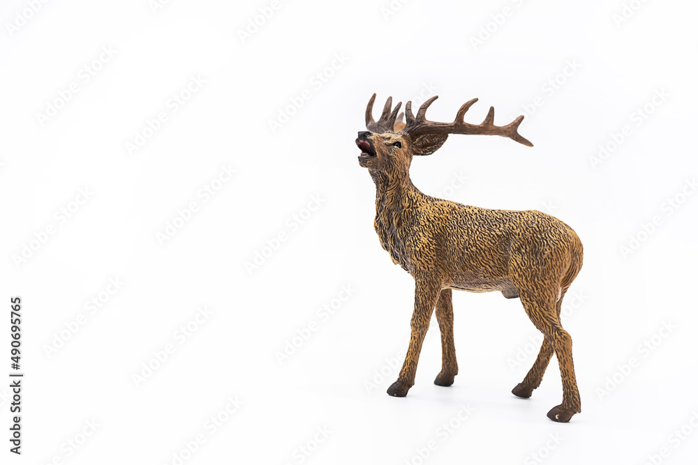 Obraz premium Toy animal figure deer on white. 