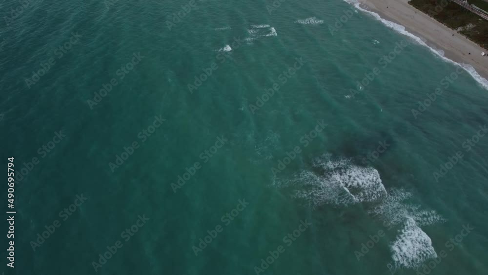 A breathtaking video from the ocean waves to the beautiful landscape of Miami Bech filmed by drone during the sunrise hours A breathtaking video from the ocean waves to the beautiful landscape of Miami Bech filmed by drone during the sunrise hours