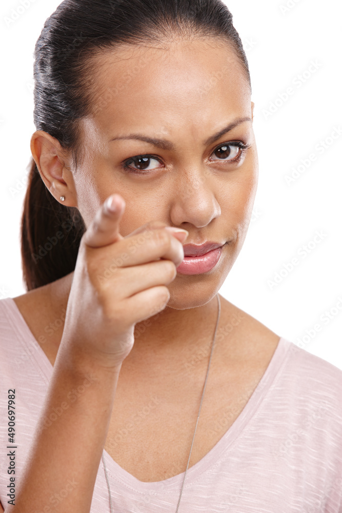 Im not done with you. Cropped shot of an angry young woman pointing a finger towards the camera. Im not done with you. Cropped shot of an angry young woman pointing a finger towards the camera.