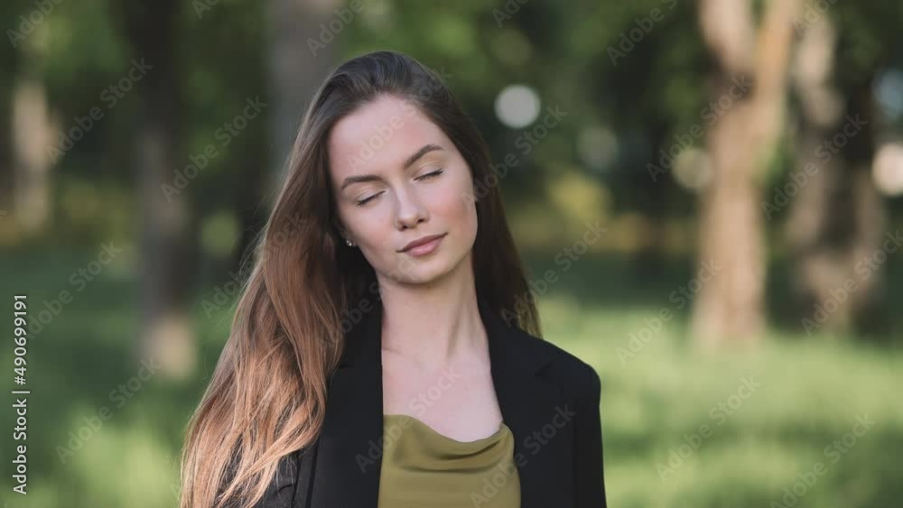 Portrait of a young student in a city park. Portrait of a young student in a city park.