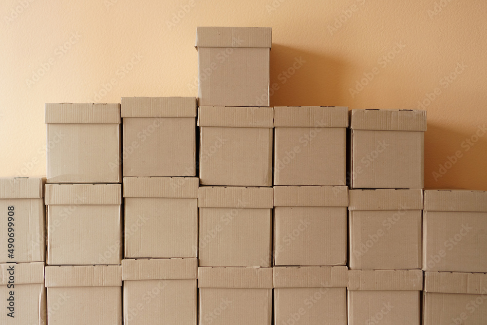 Set of cardboard brown boxes in storehouse. Background of carton boxes in wsrehouse Set of cardboard brown boxes in storehouse. Background of carton boxes in wsrehouse