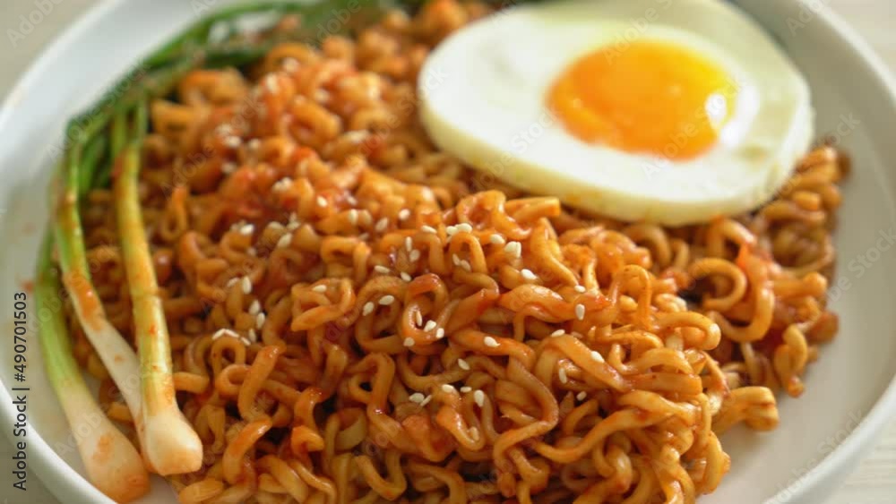 Homemade dried Korean spicy instant noodles with fried egg Homemade dried Korean spicy instant noodles with fried egg