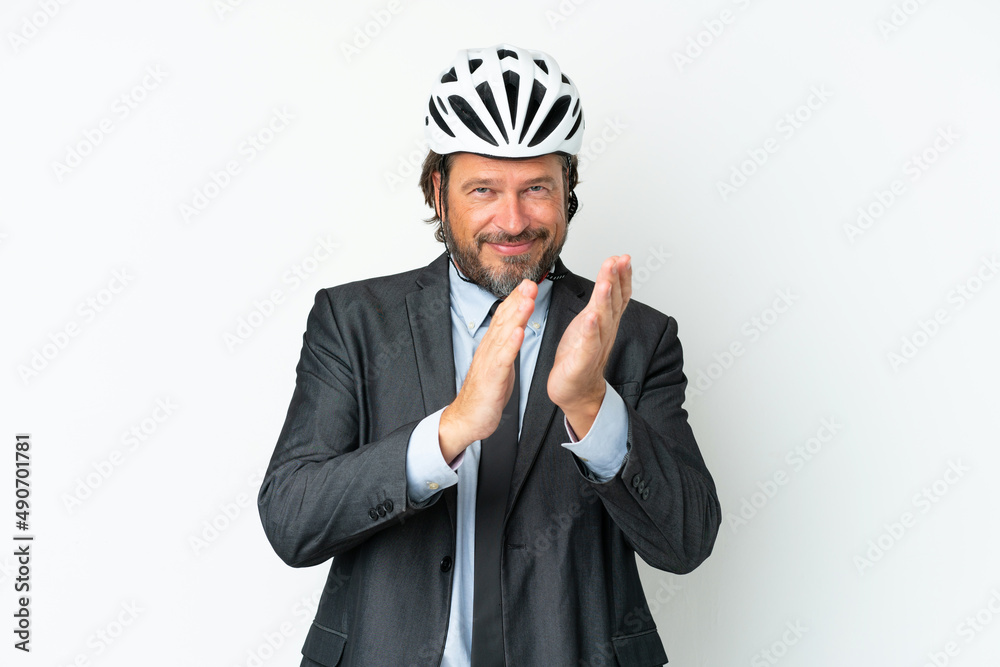 Business senior man with a bike helmet isolated on white background applauding after presentation in a conference Business senior man with a bike helmet isolated on white background applauding after presentation in a conference