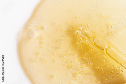 Canvastavla Vitamin C serum liquid texture with dropper, macro shot.