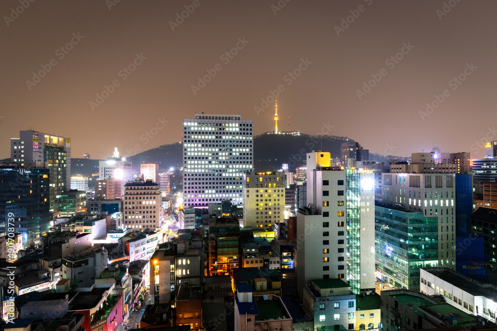 Cityscape Seoul with Tower at Namsan Mountain Park at night.