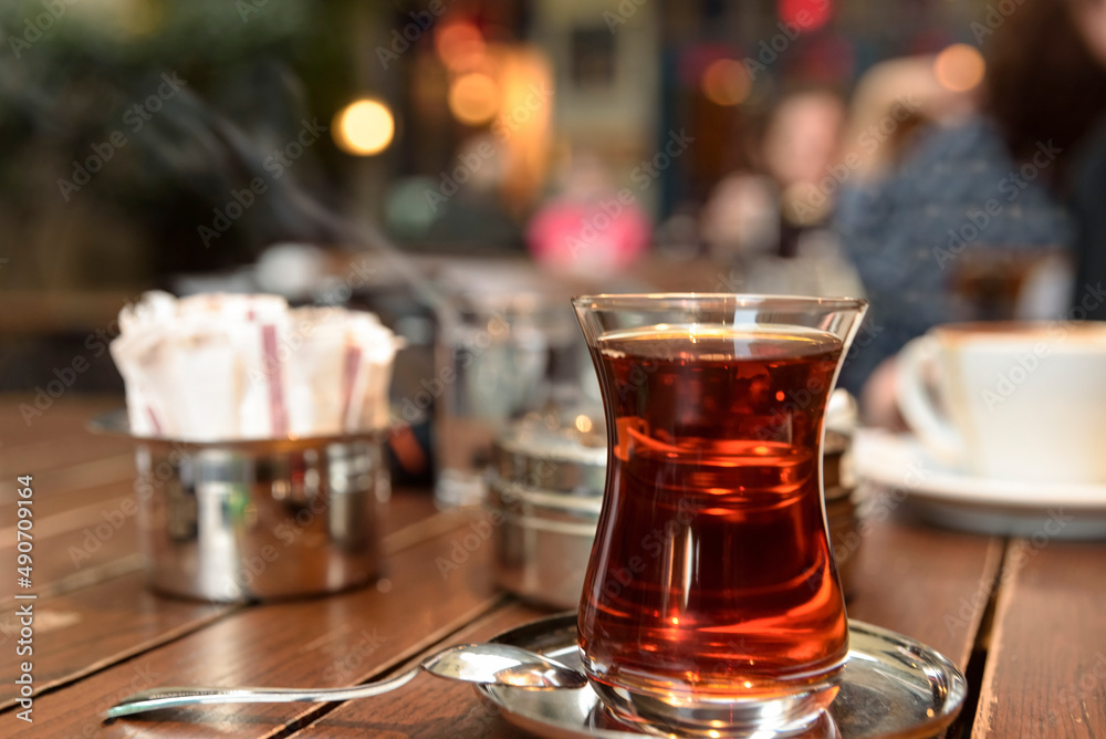 Hot black tea service in glass or porcelain cups