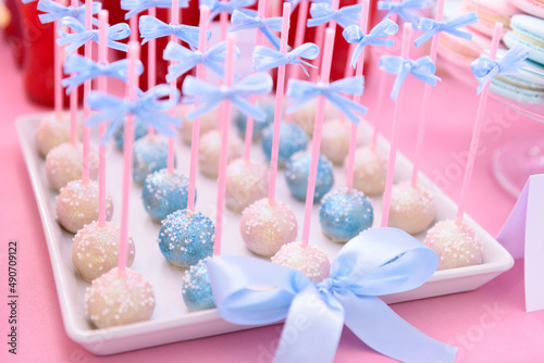 Tasty handmade cake pops on a candy bar at a wedding party