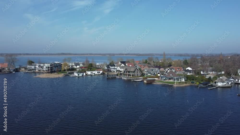 Loosdrechtse houses on dike in the Netherlands between the lakes Loosdrechtse houses on dike in the Netherlands between the lakes