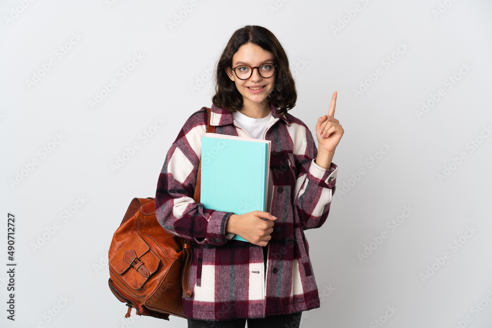Obraz premium Teenager Ukrainian student isolated on white background pointing up a great idea
