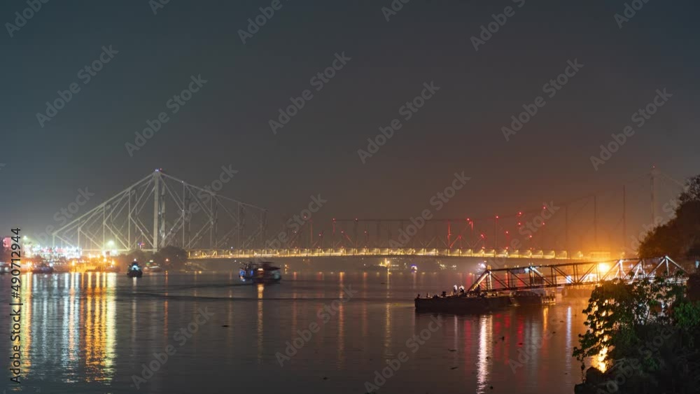 Howrah bridge on the river Hooghly with the twilight sky. The cantilever bridge is considered the busiest bridge in India.
