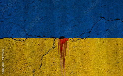 flag of of Ukraine with gunshot and blood - war background photo
