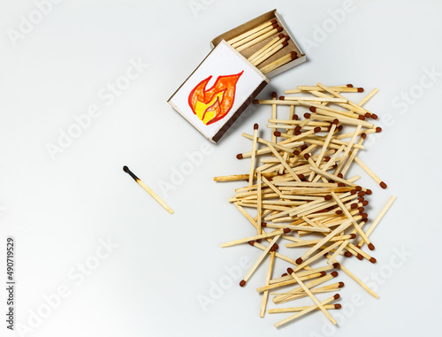 Pile of matches and box of matches on white background. ecology and tree conservation concept