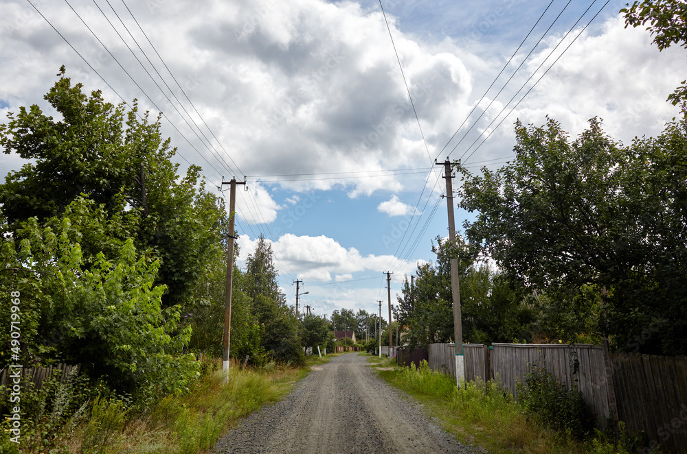 A gravel road at rural Europe. Suburban road path