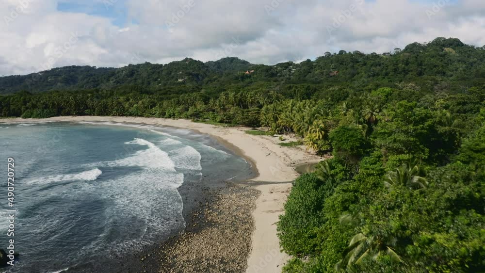Aerial drone view of big waves at the Playa Mal País beach, in sunny Costa Rica Aerial drone view of big waves at the Playa Mal País beach, in sunny Costa Rica