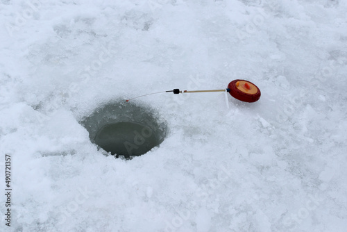 Fishing on ice in winter