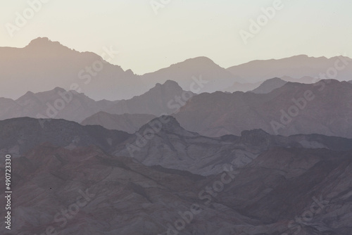 Dramatic layered mountains of Sinai in the evening. View from Dahab. South Sinai, Egypt