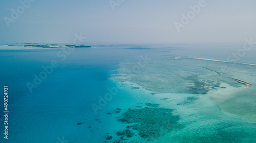 Aerial View to the Maafushi (Kaafu Atoll) Paradise Island with Blue Ocean Water and Paradise Coastline, Maldives