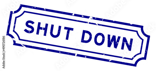 Grunge blue shut down word rubber seal stamp on white background