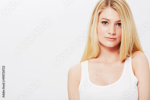 Natural, young and absolutely gorgeous. A pretty young blonde isolated on a white background.
