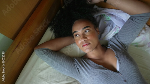 Tired woman lying in bed resting a person person in restful moment