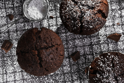 Top view Freshly baked chocolate muffins on a dark background